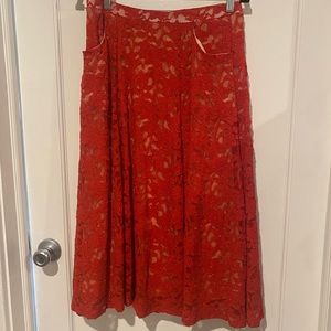 All the glitter for the season. Red sparkle red lace a-line skirt.